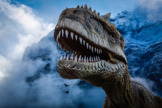 Dinosaurs on rock mountain background photo