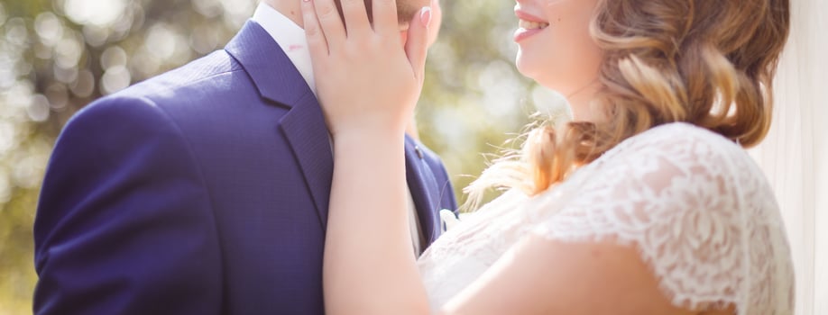 Happy bride and groom at a park on their wedding day photo