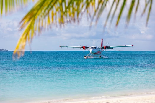 Sea plane at tropical beach resort. Luxury summer travel destination with seaplane in Maldives islands. Exotic vacation or holiday transportation, Maldives sea photo