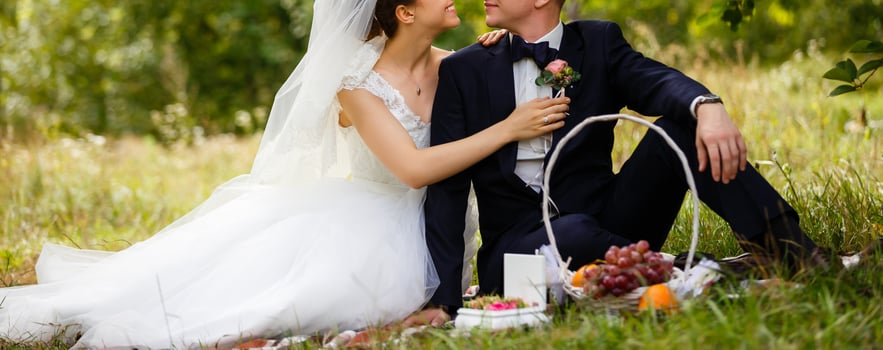 Happy bride and groom at a park on their wedding day photo