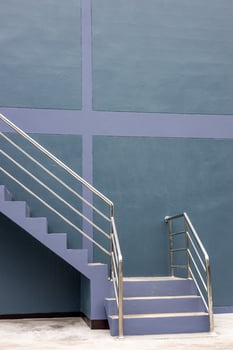 Close-up view of the background of the stairway sideways, the purple-gray wall. photo