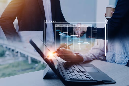 Analyst working with computer in Business Analytics and Data Management System to make report with KPI and metrics connected to database. Corporate strategy for finance, operations, sales, marketing. photo
