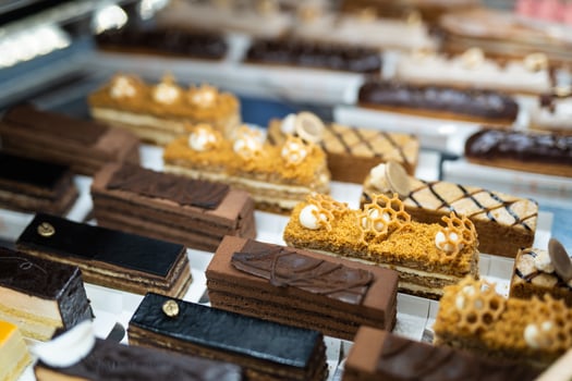 various delicious sweet pastries in the shop window. photo