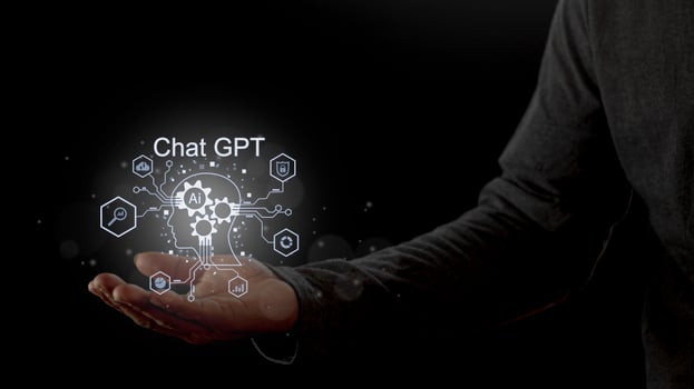 Businessman holding a light chatbot icon. Chat GPT AI or Artificial intelligence using chatbot generate photo