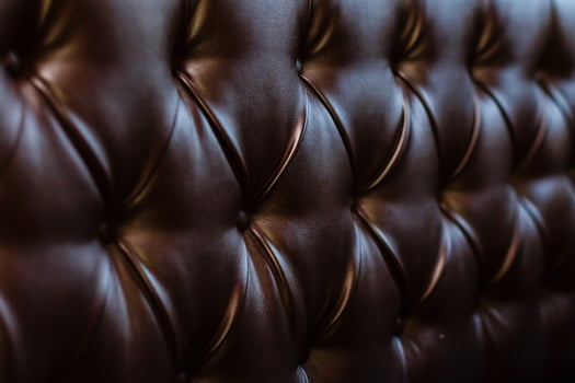 Genuine leather upholstery background for a luxury decoration in Brown tones photo