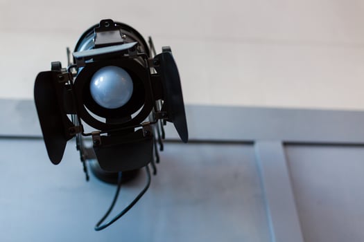 Halogen spotlight with a lens. Spot light on the wall. TV, video, photo, shooting photo