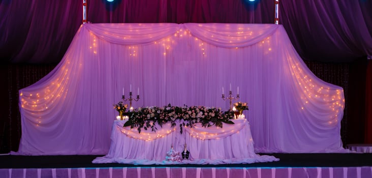 Wedding table in the restaurant with flower composition photo