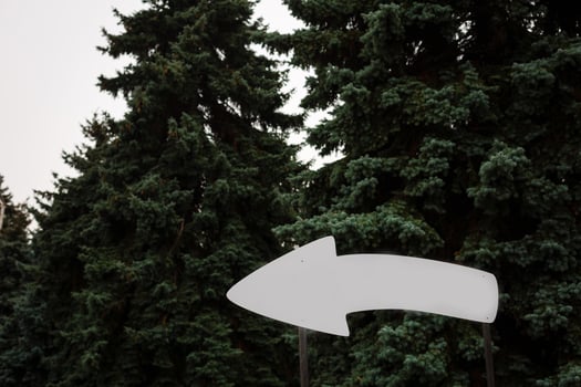 Wooden pointer arrow board for the inscription tourist concept photo