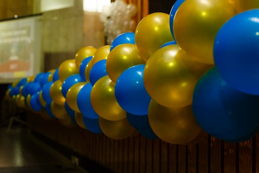 Color balls, colored polymer gel, hydrogel beads against the background of the wall and the falling rays of the sun emanating from the window. Concept holiday, birthday, congratulations photo