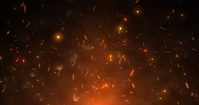 Abstract orange fiery sparks and smoke from a bonfire with fire, abstract background photo