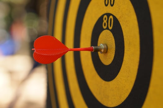 Darts on black and yellow targets photo