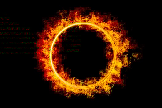 orange flame circle frame on black background photo