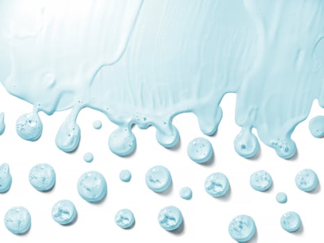 Cosmetic cream transparent liquid gel serum texture drops with microbubbles of oxygen on white background beauty concept photo