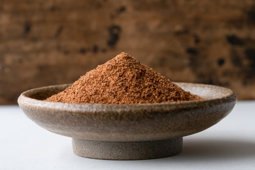 Ground Nutmeg in a Bowl photo