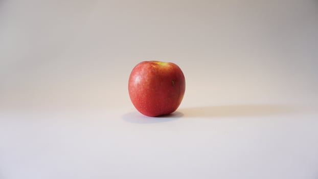 A red apple on a white background photo