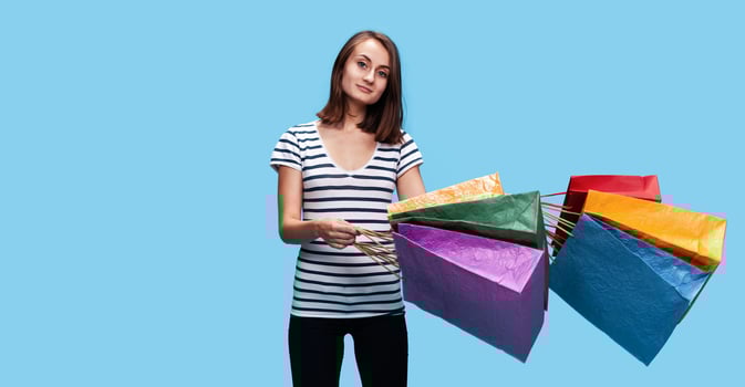 Happy young woman with shopping bags photo