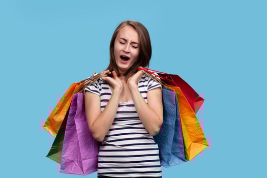 Happy young woman with shopping bags photo