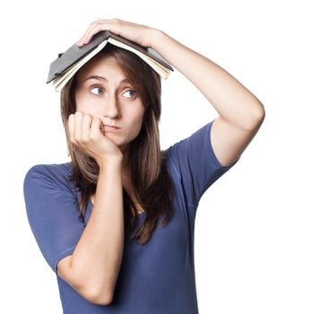 Education. Young woman portrait on white photo