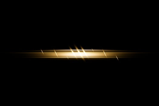 Yellow horizontal lens flares pack. Laser beams, horizontal light rays. Beautiful light flares. Flash light with fairy dust sparks and golden stars shine. Dusty shine light photo