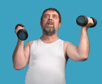 man exercising with dumbbells photo
