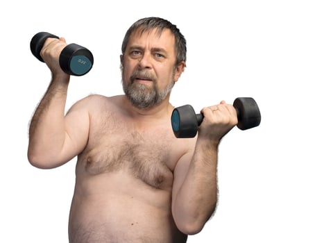elderly fat man exercising with dumbbells photo