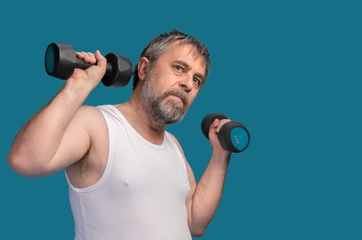 man exercising with dumbbells photo