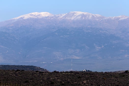 Snow lies on the top of Mount Hermon photo