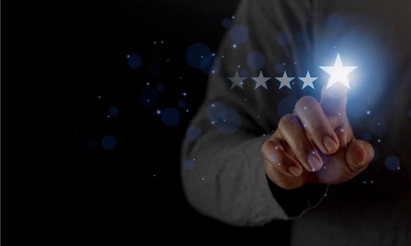 Satisfaction close up on customer man hand pressing on screen with five star rating feedback icon and press level excellent rank for giving best score point to review the service concept photo
