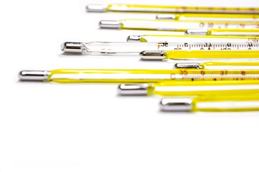 Closeup and crop small medical thermometers line up isolate on white background. photo