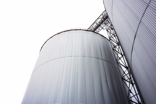 Silo Metal Sheet container settles on the ground with white background. photo