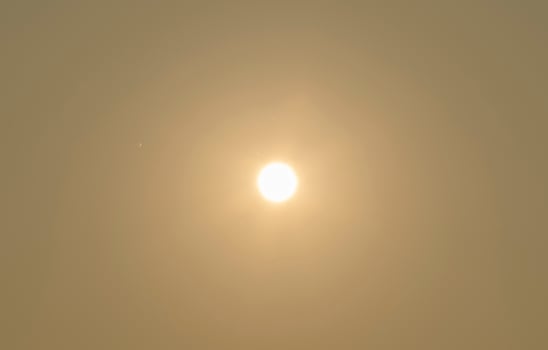 The sun on the yellow sky photo