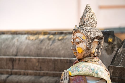 Vintage Stone Traditional Statue in Woman Character at backside of Wat Phra That Chom Kitti, a worship place at Chiang Rai, Thailand. photo