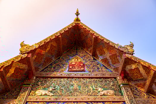 A front roof of Buddhist Temple at Wat Phra That Doi Tung, a famous Temple and Buddhism place. It's settled on the mountain in Chiang Rai province, north of Thailand. photo