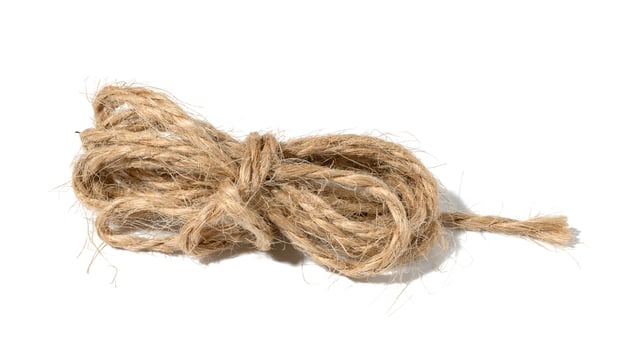 Brown twine rope on a white isolated background, top view. Packing natural photo