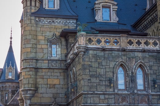 Antiquity in detail. Decoration of houses, balconies, windows, sculptures, walls. Elements of architectural design of buildings. Old plaster, Stone decorations. Elements of Gothic architecture photo