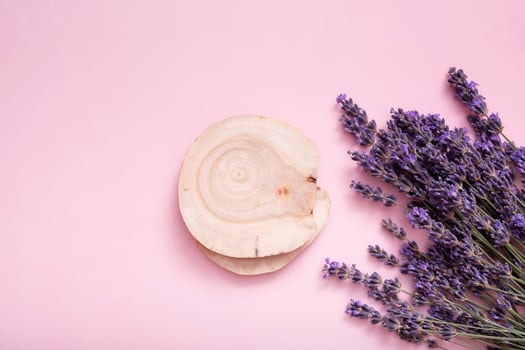 Podium, stage or pedestal with lavender flowers top view. Mock up for cosmetic products photo