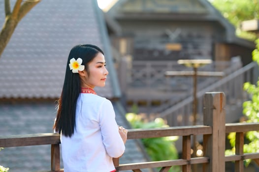 Asian woman wearing typical thai dress with red umbrella.,Thai costume photo
