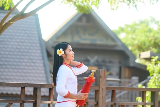 Asian woman wearing typical thai dress with red umbrella.,Thai costume photo