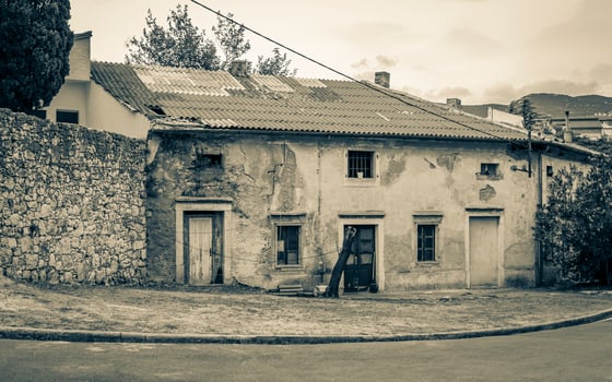 Old abandoned broken dirty house building in Novi Vinodolski Croatia. photo
