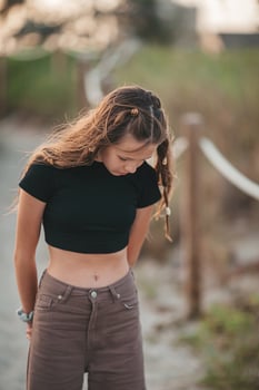 Cute teen beautiful girl having fun on tropical seashore photo