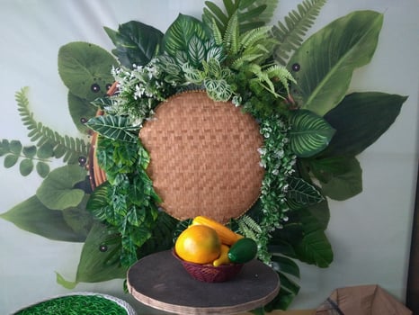 Crafts from beautiful leaves and flowers in the middle there is space for writing made of woven rattan called tampah photo
