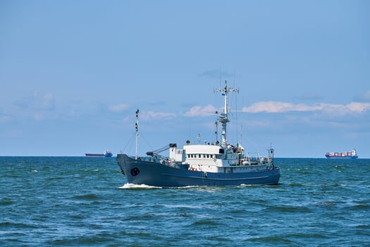 Survey vessel, research vessel patrol boat sailing in bright blue Baltic Sea, navy patrol vessel photo