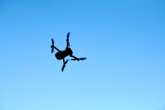 Quadcopter drone in sky photo