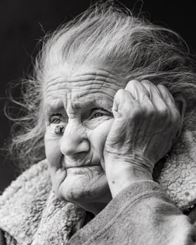 Very old and tired wrinkled woman outdoors photo