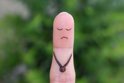 Finger art of a lonely sad man. photo