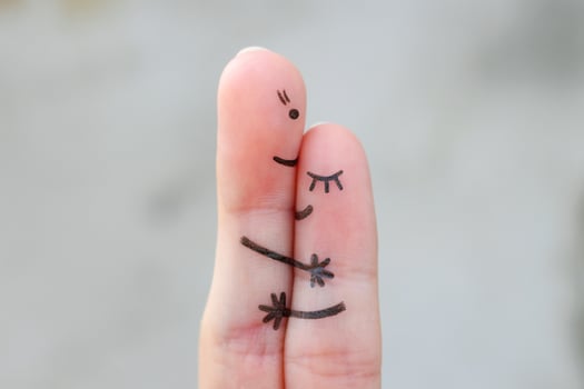 Fingers art of mother hugs her daughter. photo