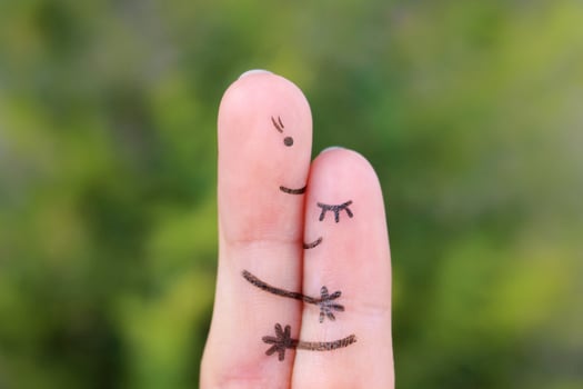 Fingers art of mother hugs her daughter. photo