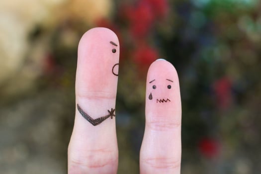 Fingers art of family during quarrel. The concept of father scolded his son, he was crying. photo