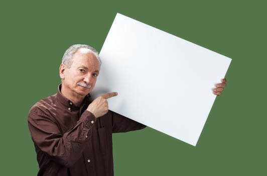 Senior man holds a blank board photo