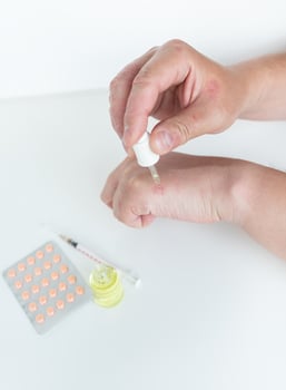 A man spreads healing gel on his hands. Causes of itchy skin can be dermatitis eczema, dry skin, burns, food allergies. healthcare concept. photo